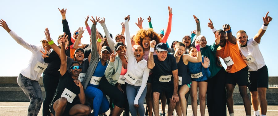 A group of runners celebrating at a race
