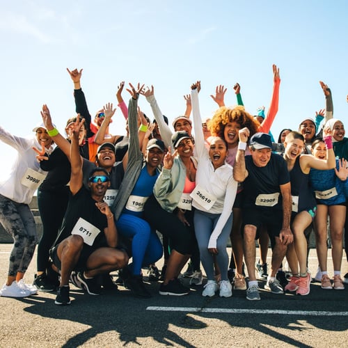 A group of runners celebrating at a race.